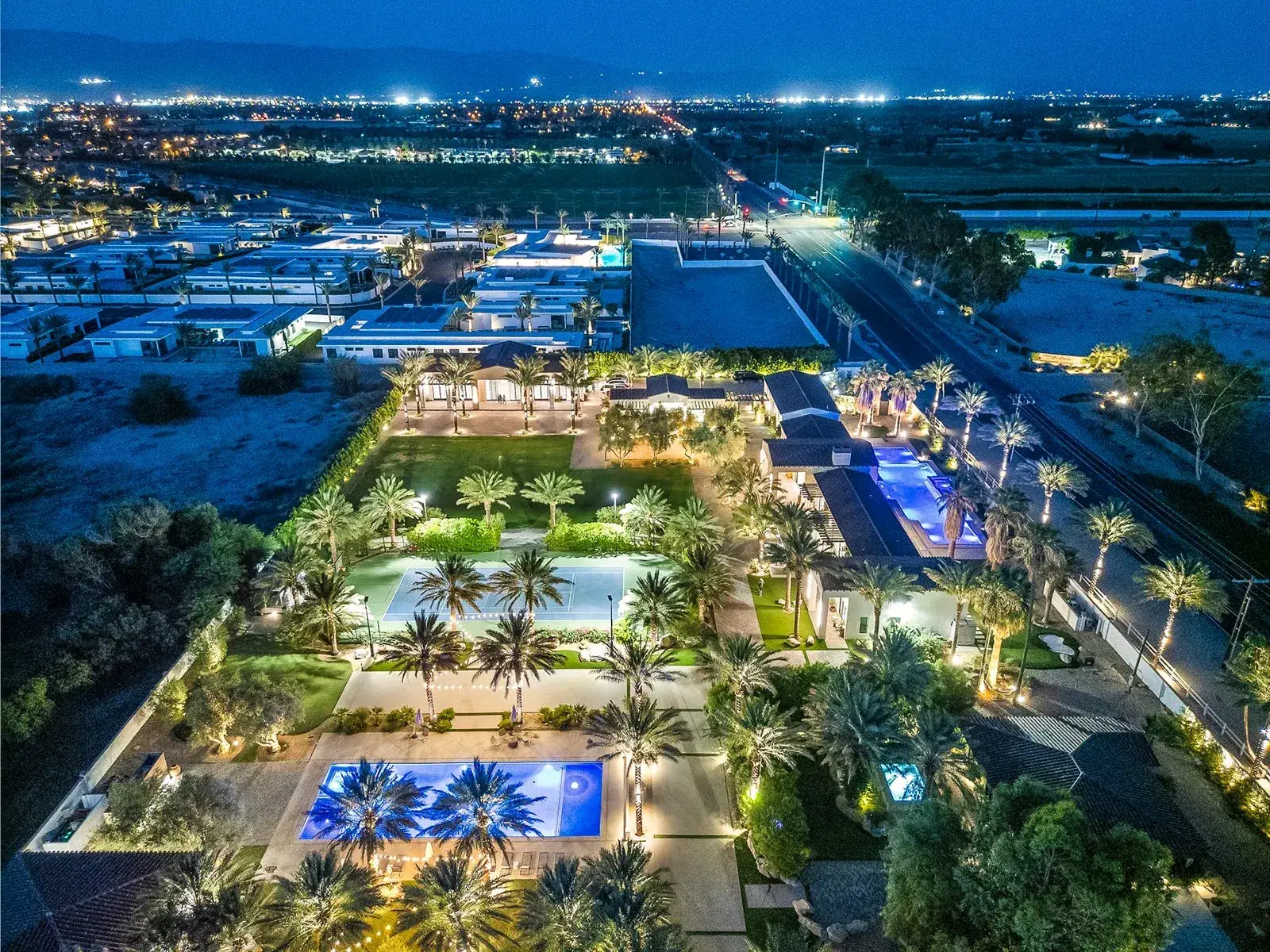 The estate grounds at dusk, seen from above