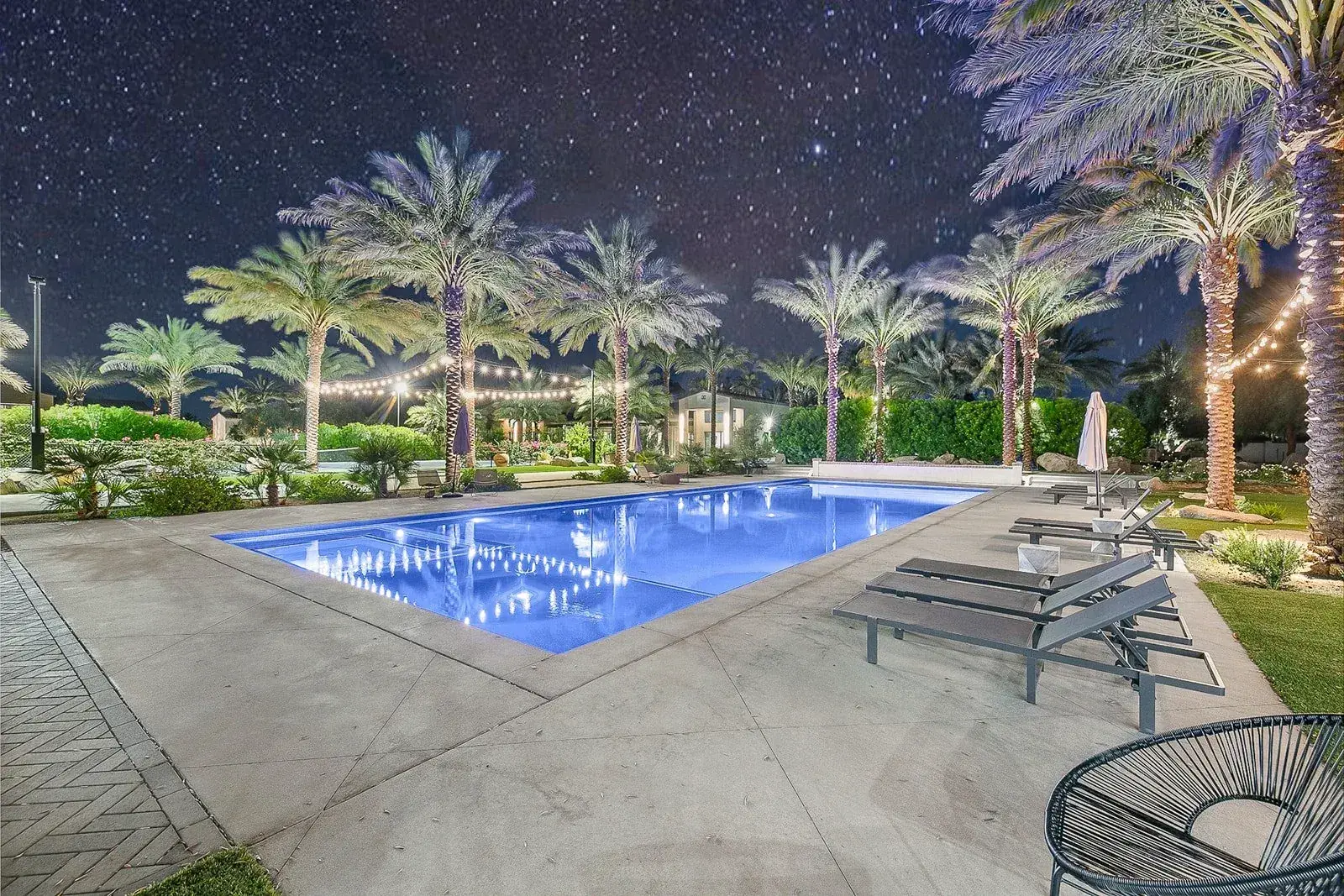 Estate pool under a night sky