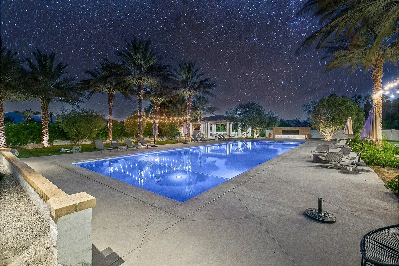 Estate pool beneath a night sky