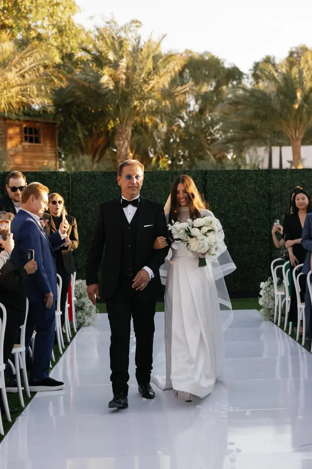 Wedding processional on the estate lawn